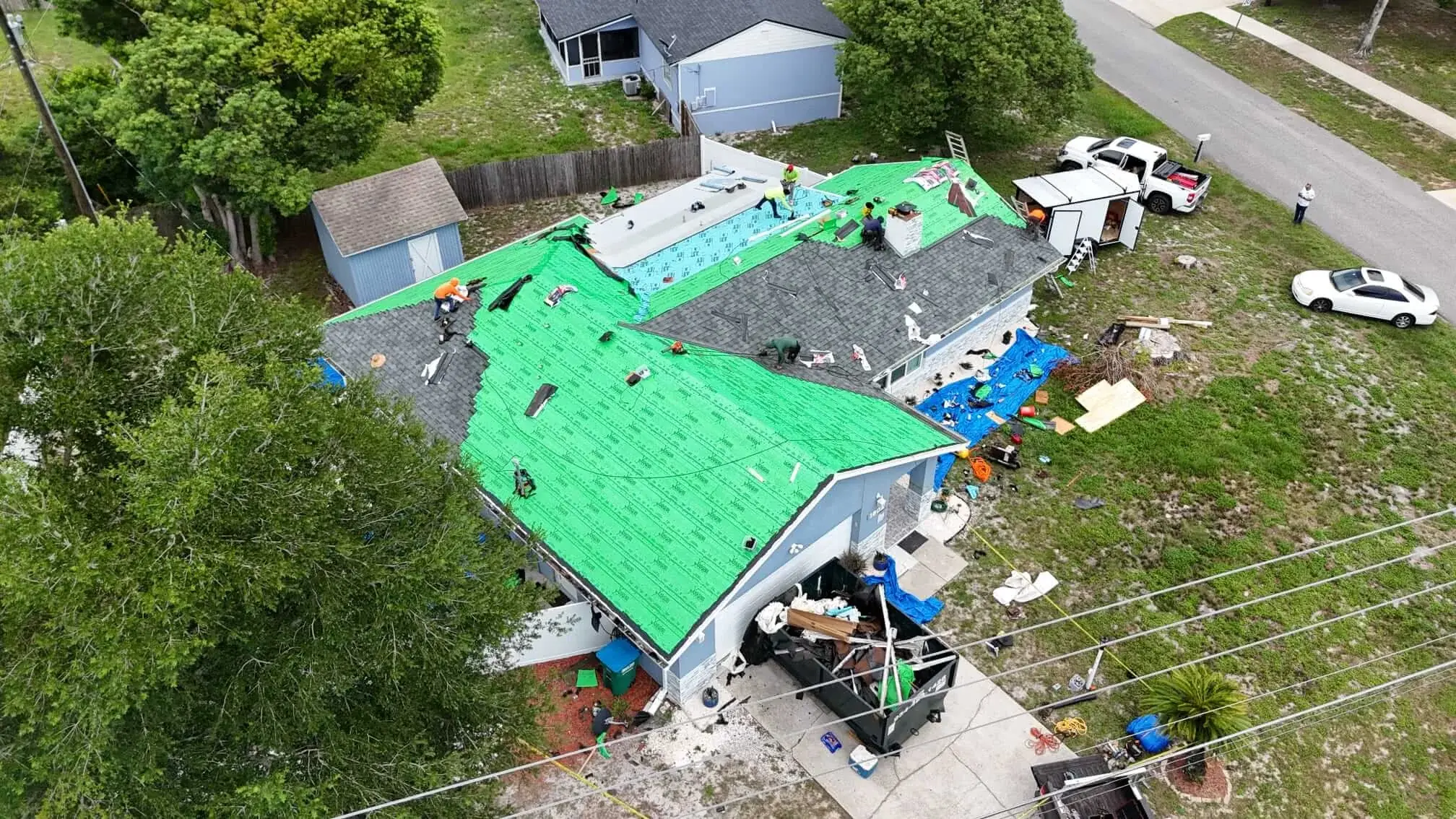 Installation progress — underlayment and shingles being applied